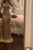 I love this dress it's very high quality and comfortable. The only thing I would add is that it could be a little tighter but honestly fits me so well. I love the shimmer and the cut but obviously, with me being a short girl it is definitely long. - Lauren K.