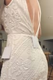 I wanted to review this dress since their aren't many good pictures of it. This is a beautiful dress!  It's heavy but feels nice on. I need to have the straps taken up maybe 1-2 inches and then the V is where it should be in the front and back. The train is long and heavy and doesn't drag well. It rolls up. I'll have that trimmed off as well. - Nichole G.