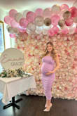 I bought this dress in a size M for my baby shower! I am normally a XS or S, but as I'm 8 months pregnant, I opted for a larger size to ensure it would be stretchy and comfortable enough to accommodate my bump and it worked out great! Got tons of compliments and was comfortable and gorgeous! - Kate K.
