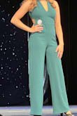 I bought this for my daughter for her to wear in the high school pageant and it was perfect.  The color was absolutely beautiful and it fit her like a glove.  She said it was very comfortable and the length was perfect with her heels.  It might be a little long if you are planning on wearing flats. Also, she did have the back straps taken in a bit just to give her a more secure fit across the bust since she was going to be up on stage and didn't want to worry about having to adjust her outfit.  If you are looking for a classy, beautiful jumpsuit, then look no further.  Buy it.  You won't be disappointed.  **Photo showing the back is the true color. Front photo was taken under stage lights with phone but still gorgeous.** - Mary G.