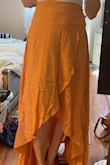 The material reminded me of a bed sheet.  Not flowy like the picture.  Wrinkles easily.  I returned. - Jena S.