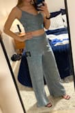 This outfit is gorgeous and SO sparkly!!! It seems to run slightly larger than other items I have purchased from Lulus - the waistband is about an inch too big so I will need to pin it or get it altered. I am 5'7 and with 2.5" heels, the pants are the perfect length. The top is fully adjustable which is amazing!! Only gave it four stars because unfortunately, it sheds glitter every as you walk, sit down, etc. Still cute though if you don't mind leaving a trail of glitter lol. - Samantha J.