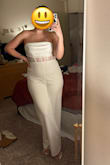 Buy this right now! This jumpsuit is so flattering on me. I will say I will have to wear shapewear for my tummy since the white and the material shows off my belly. But that's no biggy for me! Can't wait to wear it to my rehearsal dinner. - Brittany S.