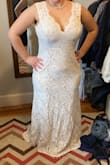 This dress is perfect!! I tried so hard to find something with this silhouette in stores and struck out, I'm so glad I took a chance on this. The fit is amazing, I will probably have the waist taken in a tiny amount closer to my wedding date but otherwise, it's ready to go! It is incredibly comfortable and the lace looks beautiful in person. If you're on the taller side or planning to wear a taller heel it might be a bit short, but for my height wearing flats, it's perfect. The quality of this dress is on par with the $1,500 dresses I tried on in stores, at a fraction of the price! - Phoebe L.