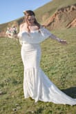 I thought this dress was going to be too big when I first put it on but was I pleasantly surprised!! Fit like a glove. The best fitting dress I have tried on. Perfect for a beachside wedding. This dress was perfect in every way. I am usually a medium and it is true to size. The only downside to it is the bottom of the dress has no stretch in the seam. Other than that I LOVED IT!! - Michelle M.