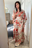 This dress is much more beautiful in person. Matte finish is beautiful and tied back giving this dress the perfect silhouette. The dress is long so I'll have to get it hemmed. Originally ordered S sized down to XS. - Natasha L.