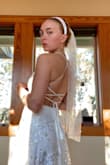I ordered 2 dresses for my wedding day, very confident one of them would work. And of course, this one checks all the boxes! It is actually very comfortable considering the lacing up in the back. It's a bit long for me (5'5") so I had to find the perfect heel. The quality looks surprisingly REALLY nice. It's worth every penny and I am so grateful I found the dress I get to say "I do" in. :) - Miciah A.