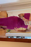 I am very impressed with this dress! The magenta color is honestly to-die-for. The fit was as expected, maybe slightly snug (I ordered my usual size M). I didn't expect the slit to be as high as it is, but I think that's because my hips are wider than average. The fabric is stretchy and thick enough to smooth out bumps. Love it overall! - Grace H.