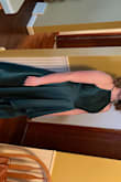 The dress is beautiful and the material is of great quality. The strap on my shoulder was twisted and couldn't be fixed like it was sewn that way. The color was also a little darker than I expected. I bought the XL because everyone was saying it was small and I'm glad that I did. It fit great and has pockets. - Julia K.