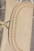 Love the style of the bag. And I like that it comes with a strap. The color I bought was ivory and it definitely has a blush hint to it. - Erica M.