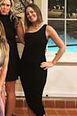 This dress definitely hugs everywhere but because of the ruching and the fact it has a built in slip I never felt like it was too revealing or too tight (not like a typical bodycon dress!) I wore it to a Catholic school fundraiser and did not feel scandalous, just classy. :) - Greta F.