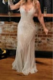 This dress photographs beautifully! It took a couple of orders to get the right fit, but the customer service is out of this world amazing and the dress was on my doorstep in days. I got compliment after compliment all night! I know it can be scary ordering a wedding dress online, but I would 10/10 recommend this dress! - Justin M.