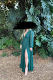 It's chiffon, its low cut, its a beautiful color (I got it in emerald green). I will say you're gonna need nip covers but use ones that are thin because the material is thin in that area. - Shanell D.