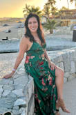 I felt beautiful in this dress. I was between sizes and ended up keeping the small because the medium was back-ordered. Medium would have been better. The dress was great quality and color vibrant. - Ziomara A.