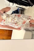 This is my favorite lulus purchase ever! I sized up to a large (I am usually a medium) and it worked out great, it is so flattering. I would say if you have a larger chest you definitely need to go up in size! Highly recommend. - Madchen Z.