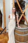 My husband and I decided to do a ceremony now and our reception will be in September. With little dress shopping time, I fell in love with this one online and was so so happy seeing it in person. Very flattering and fits like a glove. I will definitely be wearing it for the reception as well. The back does not allow for a bra, I would recommend the individual adhesive/lifting cups as there are no built-in cups. - Devynn B.