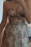 I love it! The bustier's perfect. I'm quite thin, but I have big hips, even though, the size fits like a glove. The dress is REALLY long, so, keep in mind that probably you would have to pay more to cut it. The fabric's not bad. The print's beautiful. - Paola L.