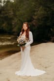 The stress was absolutely beautiful and perfect for my small wedding. It fit like a glove and the material was thick and not see through. The low cut back followed by buttons all the way down were so pretty and the perfect touch. I felt like a princess without the floof. 10/10 recommend! - Amanda H.