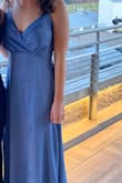 The color is gorgeous! The material also has a nice texture to make it more unique. It looks great freshly steamed but does crease a little bit if you're sitting down, getting in and out of cars, etc. I wore it to a February wedding and got tons of compliments! - Kenzie M.