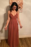 The dress is a tad heavy but it's perfect! It has the perfect fit and flow to it. I am absolutely in love!!! - Gabi P.