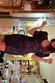 I listened to the other reviews and ordered a size up. Normally I wear an XS and got a size S. It was still VERY SNUG but I could squeeze into just fine. My biggest concern wasn't that it was snug, more so that the neckline showed off way too much chest. I'm small chested and I was falling out of this all night. Also it was snug in the shoulders so I was worried I would hulk out of the top. It's beautiful, just very specifically shaped for someone who is very tiny all around except for the bust. It worked for NYE and was fun enough for the one night but sadly I won't be wearing it again because I popped out too much, specially wearing a bra. - Kay F.