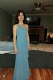 The dress fits perfectly in the bodice, torso length, waist, and hips. It's a little long but can easily be hemmed. I love the colour! - Ann I.