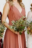 I loved the color of this dress. It's a little heavy, there's a lot of fabric on the skirt. I'm 5'10 and wore flats and the dress was a little too long. I wore adhesive bra pads and TONS of body tape so that the top wouldn't move or gape. It's overall flattering to the upper body but did not accentuate my waist as much as I would have liked. - Brittany H.