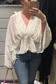 I read the reviews and ordered one size down. I am usually a large in tops but this top is flowy so the medium was perfect. I wore it with jeans and wedges and threw in a pink bag for color. I came back to Lulus to order the black. - Angela I.