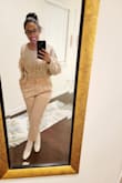 Absolutely love these.  Super stylish and amazing for fall/winter, even in white.  The white does look pale pink but they literally go with everything.  I wear a 9, but the 9 in these were too small, and it would have been uncomfortable trying to stretch them out for a comfortable fit as others have done.  Half size up would have likely been perfect, but since they don't make 9.5s, I ordered a 10 and they feel so much better.  They are not too big! - Tamara O.