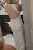 Fits perfectly! Like it was custom made! The fabrics and details are very pretty as well! Also loved that sent a dress bag that you can hang and keeps it protected! Could not be any happier with this dress!! - Celimar B.