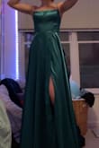 I bought this dress for Junior Prom. I wanted something affordable but beautiful, and this was it! It's very very long, about a foot of extra material hangs around my feet. The "sultry" lacing in the back makes the dress very adjustable and unique to what else may be on the market. There are cups in the dress so there's no reason for a bra which is amazing. I think even if I had a bigger bust, it would still fit because of how adjustable it is. My mother is even ok with the slit and the only time it's open is when  the dress has movement. I'm built like a door but this dress makes me feel like a million bucks! - Abbie J.
