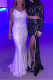 I loved this dress!! I wore it to a NYE wedding and it was perfect. It's the perfect combo of elegant and sexy. It was so comfy and fit me very well in all areas. I originally got the Medium based on reviews and because I was worried about my little belly but it was too big so ordered the small. The small fit me so well and hid my stomach. I wore 4 inch heels with it and the length was perfect. - Tara D.