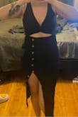 Dress fits well, very comfortable material and stretches but also feels thick enough to be secure. The only thing is that I didn't realize how high the slit goes - still wearable, but the other buttons are only for decoration and you can't button them down to make the slit smaller. Very flattering, and I like my dresses a little tighter so I ordered a Medium instead of a Large and it was perfect. Also my boobs are not the perkiest, so I had to wear a good push up bra which is hidden completely thanks to the design. - Deanna H.