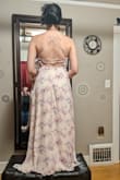 I got an XS despite technically being an S, and it fits perfectly - I think I wouldn't even have had to hem it. I'm so short that my bridesmaids made me stand on a stool, haha. I got it as part of a big order to choose one wedding dress, and it didn't make the cut but was lovely regardless! The color in the pictures is cream, but the color in real life is more like light pink. - Esther C.