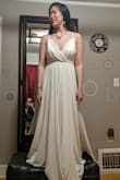 If you want a 'traditional' but simple wedding dress, I think this is it. The skirt is really heavy and nice, and I loved the inner silk layer, so comfortable!
It flattered the silhouette rather better than you see in the photo, but I think I would have wanted it tailored. It was definitely long and would have needed hemming. - Esther C.
