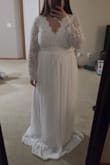 The dress is beautiful, but run a little large at the top. If you are short, I highly suggest getting the dress hem. I ordered a M and L because of the mix reviews.  I wear pants size 10/12. The lace upper part was loose and waist was snug in M. Ordering a size down would not solve the problem in my case due to the waist is snug in M already. Overall, beautiful dress but did not look good on me.  I ended up returning both dress. In this photo, I was wearing 4.5 inches heels in the M and dress was still very long. Hope this help. - April V.