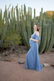 Only rated this dress a little snug due to the fit in the chest which in all fairness buying something when you're pregnant is a task within itself. This dress is absolutely stunning and I would recommend it for maternity and normal photos and occasions. - Alison P.
