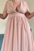 I originally ordered the large at the suggestion of the size calculating tool and found the top to be rather loose and unflattering. The medium fit just right. I would suggest ordering this dress based on your waist measurement as opposed to your bust or hips. - Mary J.