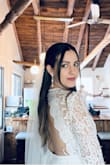 Loves this dress. Great quality and beautiful details. I thought the arms would be more form fitting but they were a looser fit. Also was pretty long even with heels. I would have gone a size down and probably hemmed the bottom for length reasons. - Magda C.