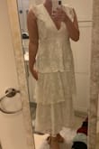 This dress is so beautiful! The color was true to the photos, more of an ivory. I normally wear a medium or large and the medium fit great! I bought this to wear to a wedding event and absolutely will look great at my shower or rehearsal! I'm 5'9" and it hits a little above my ankles perfectly for a cute cropped look, but not quite as short as a midi dress. I also love the deep v neck, very flattering! It is a little sheer, but nude undergarments work just fine. There's a nice lining too so it's not itchy at all. So cute! - Abbey M.