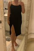 This dress looks gorgeous online but wasn't quite made for my body type! It's hard to tell in the pictures, but it has a ruched gathering right at the top of the slit. That part was very flattering, but because there wasn't any ruching anywhere else it wasn't forgiving in the rest of the stomach area. The fabric is very softy and stretchy, super comfortable. Sizing up would maybe help for a looser fit, but just wasn't quite for me. I also didn't love the slit, it was kind of awkwardly wide and only looked good if I was posing. - Abbey M.