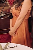 Love this dress. Had it hemmed and had the front Sewn a little to prevent it from showing too much cleavage. The colors so pretty. I want another color
I had tried the M as well and its pretty stretchy but the L fit my bust comfortably
I regret not getting a better pic of just the dress - Natalie R.