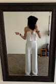 It was very flattering on my body type- tall and more athletic build. With jump suits I get scared ordering them online because sometimes the torso is too short, but not a problem with this one! Additionally, the top does not slip at all because there's a no slip grip at the top. It was so flattering with boots, I cant wait to wear it! You can see underwear lines through it, but I think if you just get a thinner pair you will be fine. - Eva Z.