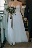 After trying on 5 wedding dresses for my elopement, this was the last one I ordered. The other reviews said it ran small...I usually wear a size 6, but ordered the biggest size (10) based on reviews. They were all right, it does run small. It fit perfectly everywhere except it wouldn't zip up completely in the back. I was really bummed and ready to send it back, when someone suggested I try to get it altered - adding a corset in the back. It worked, and turned out beautifully. I spent almost as much on the alteration as I did the dress, but absolutely loved this dress. Everything about it felt way more expensive than it was. It was super comfortable and flattering. If you love this dress and it doesn't fit, consider whether altering it would make it perfect for you. Obviously they need to size this better, but at the end of the day I was thrilled with my result and glad I didn't give up on it. I would have given this 5 stars if it fit off the bat. But giving it 4 because I had to alter it. - Jennifer N.