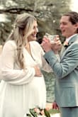 This was the perfect dress for my elopement. I got a large and was skeptical that it would run bigger like everyone was saying. I would say it is true to size. The slit on the side did run pretty high with my belly taking up all that fabric so I had to pin it. I could have gone for the XL with my baby weight (pre-pregnancy I was 180) but I didn't want the bust to fit any looser! There is no stretch in the arms or anywhere besides the waist band. It was a little tricky to pull on/off. - Amanda J.