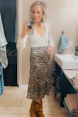 I don't love satin, because of static, but this skirt is so pretty. Love the blue detail in the leopard! It's definitely not your average leopard print! The XS fit well. Maybe could even do an XXS. - Jodie F.