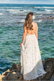 I loved this dress for my beach wedding. It looked beautiful, came out of the suitcase wrinkle-free, and the sand/saltwater came out easily. I did make a number of alterations. 1) I cut off all the little frills along the edges. 2) I needed a good 8 taken off. Instead of doing a straight hem like how the dress came, I followed the lace for an uneven hem that was shorter in the front and longer in the back to give the dress a bit of a train. 3) I shortened the straps and made them meet together in the front instead of about an inch apart. - Lexi M.