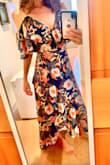 I bought this dress to wear to a wedding and it exceeded my expectations! The material itself is beautiful and high quality! I know people may hesitate to buy wrap dresses because some are revealing in the front when walking, but this dress is long enough to avoid that issue. I adore the colors, pattern, and texture of this dress! I also love that the straps are adjustable and that I don't need to wear a bra with this dress! I have a small chest (32B) and the ruffles on the top part lay in the perfect spot and the material is not see-through. The dress itself is longer on me than on the model because I'm only 5'3, however, I like the way the back part of the dress lays right above the floor and the top part of the dress fits me perfectly! I'm happy with my XS purchase and would highly recommend this dress to others! - Megan W.
