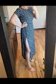 I actually love this dress! I was worried about how form-fitting it looked, but it's so flattering! It's very comfortable also. It's a little snug but I think an XL would have been too big. Super happy with it! - Kaitlyn B.