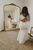 Putting this dress on accentuated all my curves in the most perfect of ways! I felt sexy and like a princess on my wedding day! I did have to take it in a little on the shoulders since my cup size didn't fill in as much, but very minor alterations. Can't beat the price! - Jannel P.